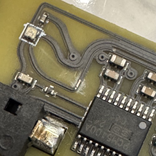 Scraped trace with bare copper visible